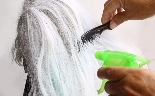 Detangling wigs with a specialist comb